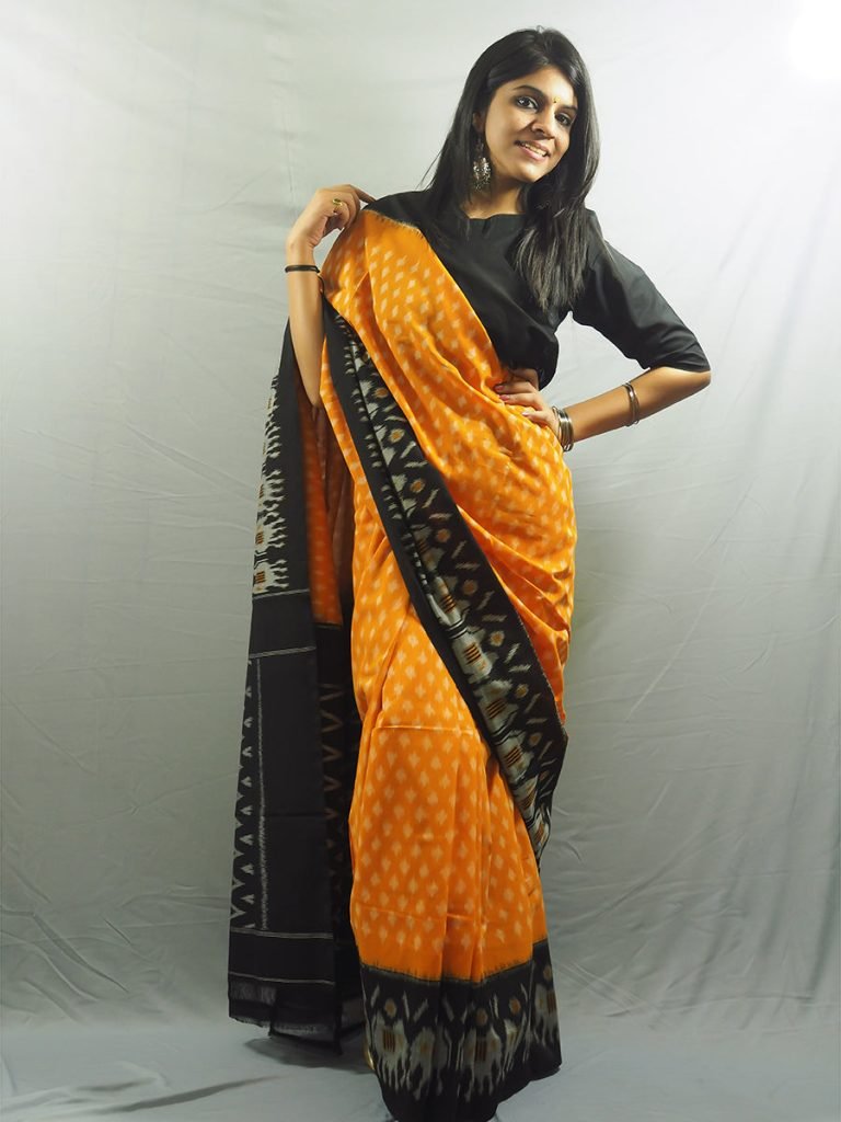 Nizami Orange Mustard and Black Ikkat Saree — photograph 3